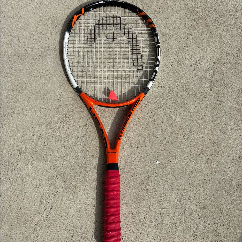 Head Tennis Racket with Orange and Red Grip